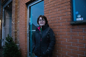 Eileen Porto stands in front of an empty storefront on Jan. 28, 2024. Formerly her vintage gift shop, Porto's store has been closed since December.
